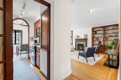 a view of a livingroom with furniture and a window