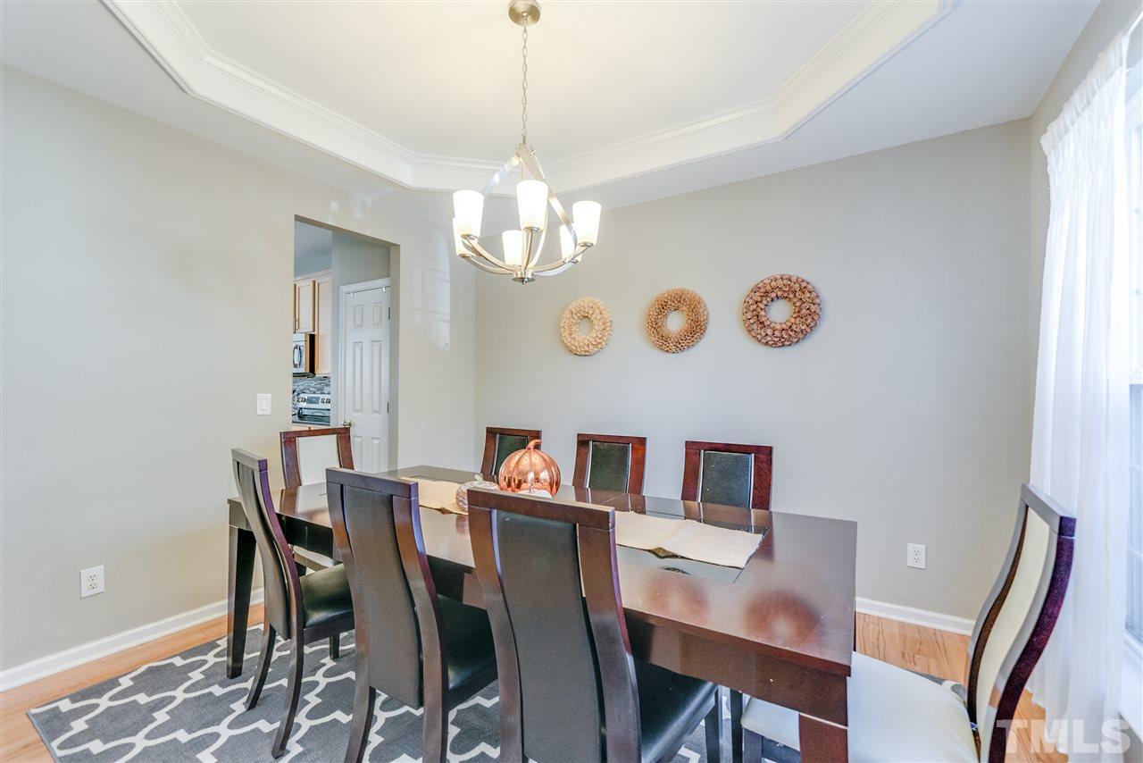 5319 Griffith Park Road Raleigh, NC 27613 - Photo 3 of 25 a view of a dining room with furniture and chandelier