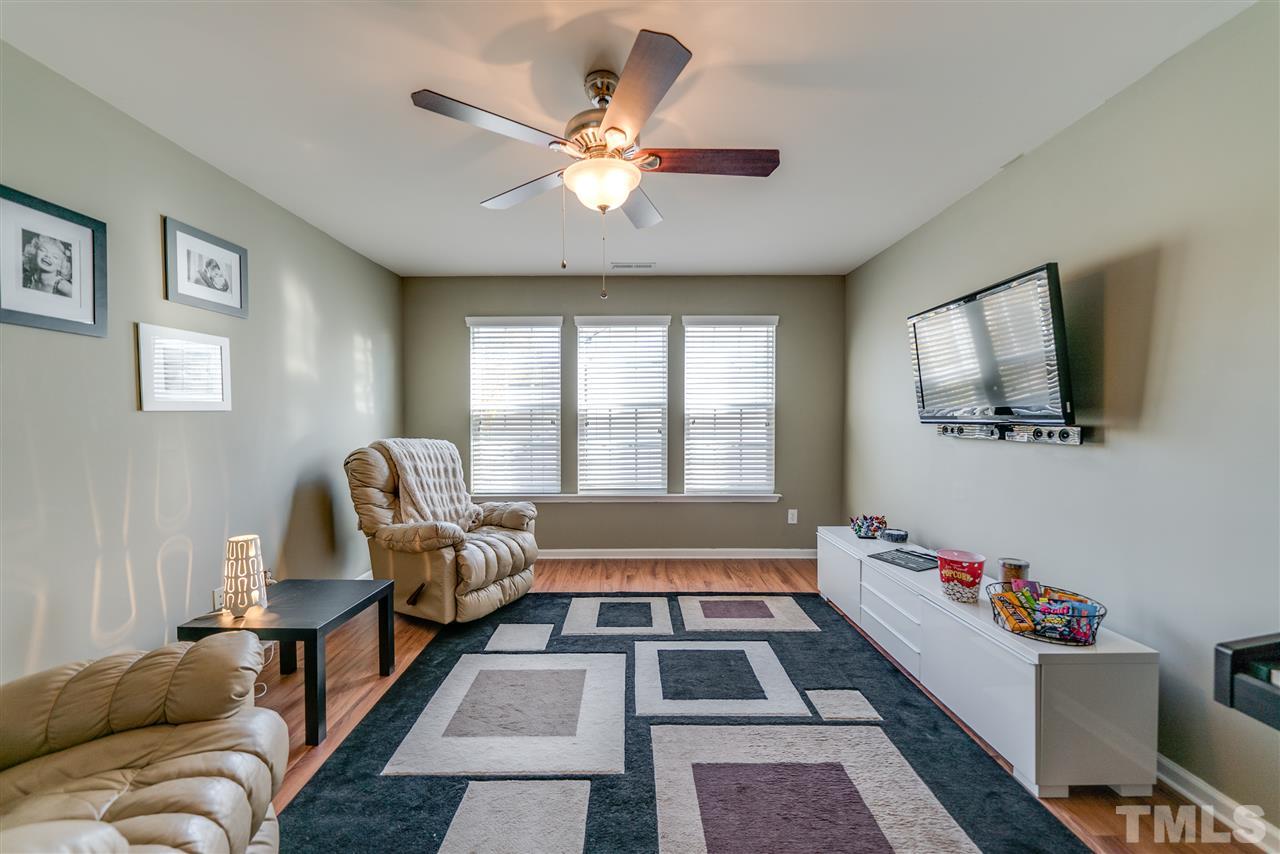 5319 Griffith Park Road Raleigh, NC 27613 - Photo 22 of 25 a living room with furniture and a flat screen tv