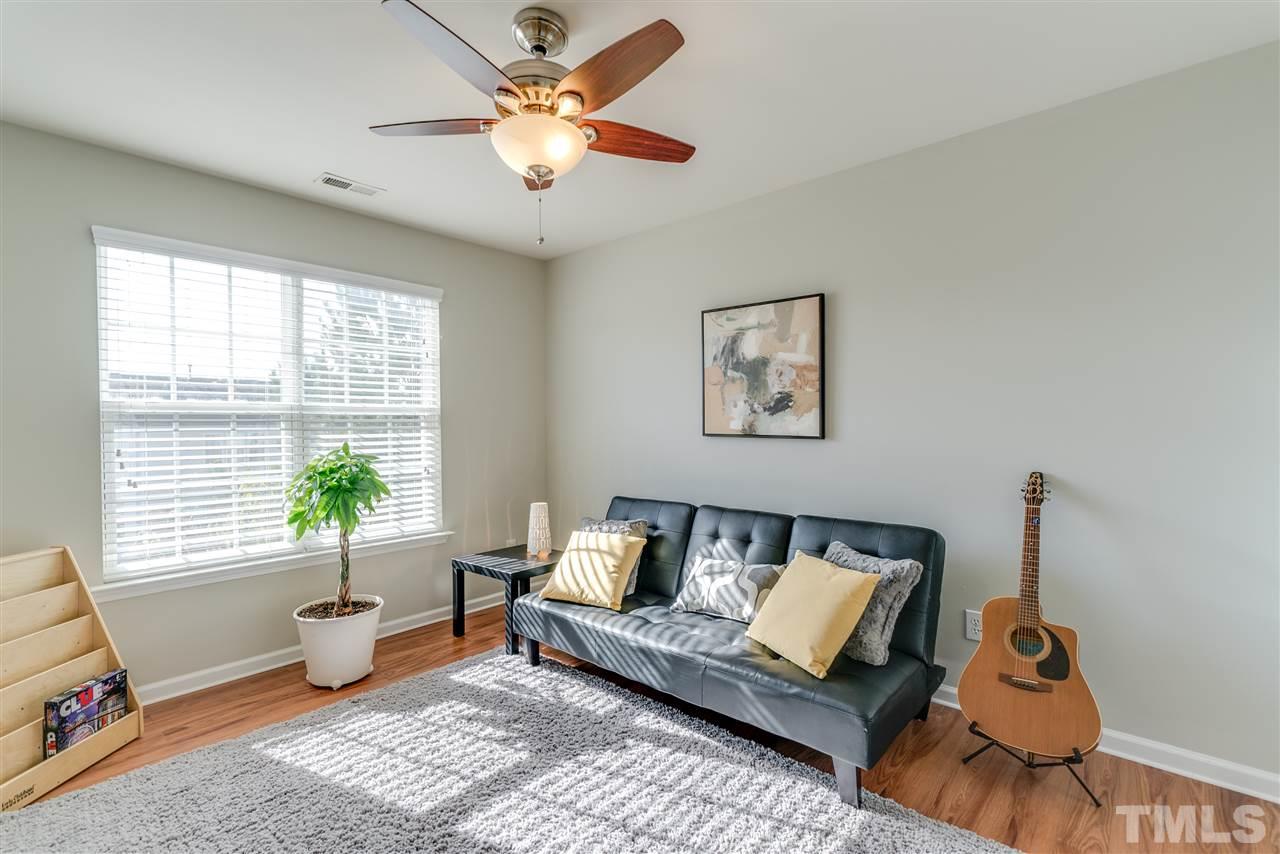 5319 Griffith Park Road Raleigh, NC 27613 - Photo 23 of 25 a living room with furniture and wooden floor