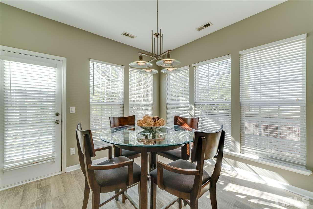 5319 Griffith Park Road Raleigh, NC 27613 - Photo 9 of 25 a view of a dining room with furniture window and outside view