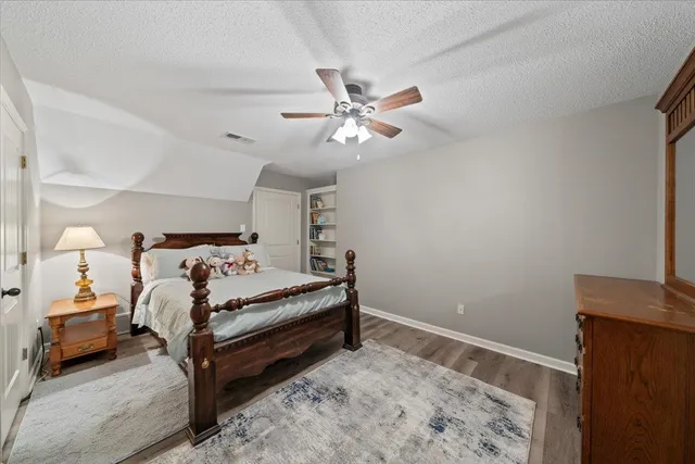 a view of a livingroom with furniture hardwood floor and staircase
