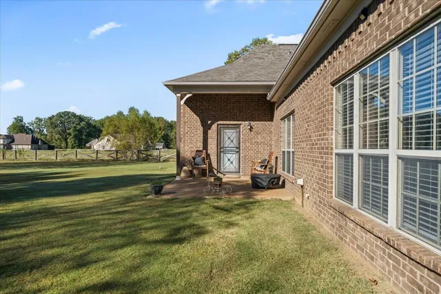 a bedroom with bed and a chandelier