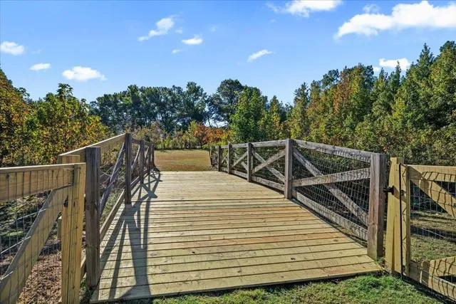a swimming pool with wooden fence