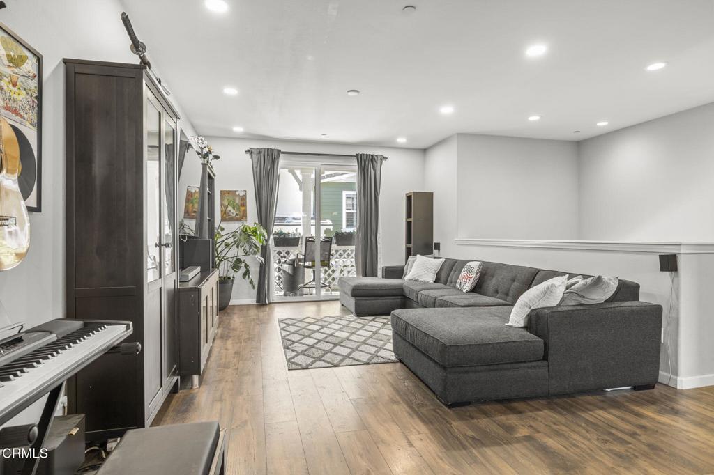 3644 Islander Walk Oxnard, CA 93035 - Photo 4 of 9 a living room with furniture and a fireplace