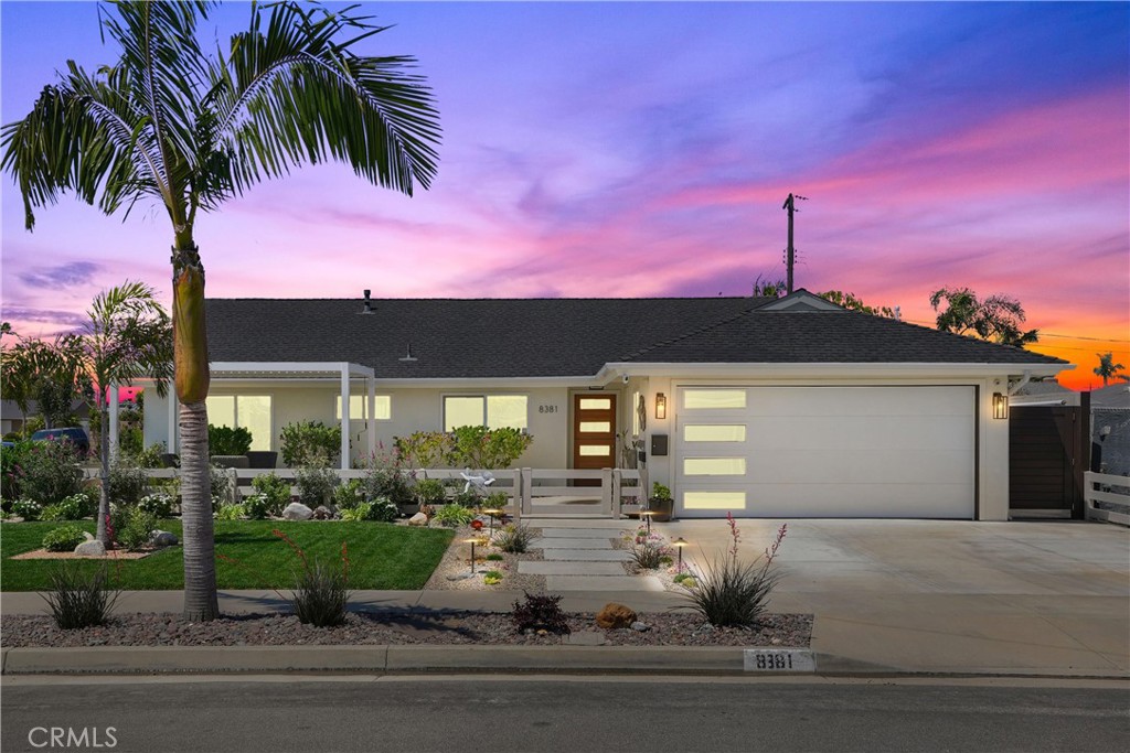 8381 Heron Circle Huntington Beach, CA 92646 - Photo 1 of 1 a front view of a house with garden