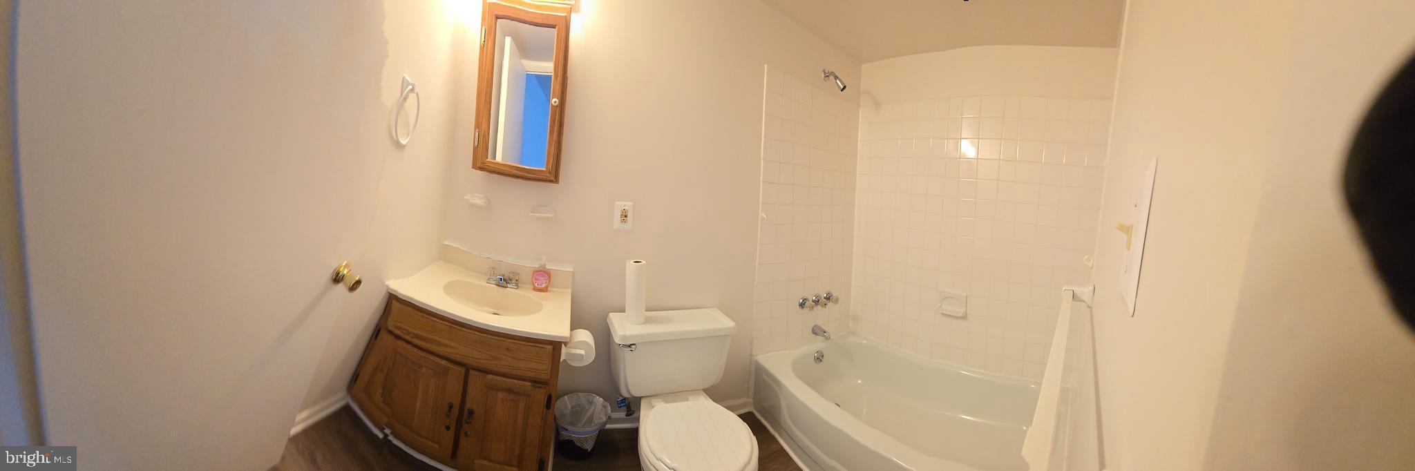 809 St Michaels Drive Bowie, MD 20721 - Photo 8 of 17 a white toilet sitting next to a shower