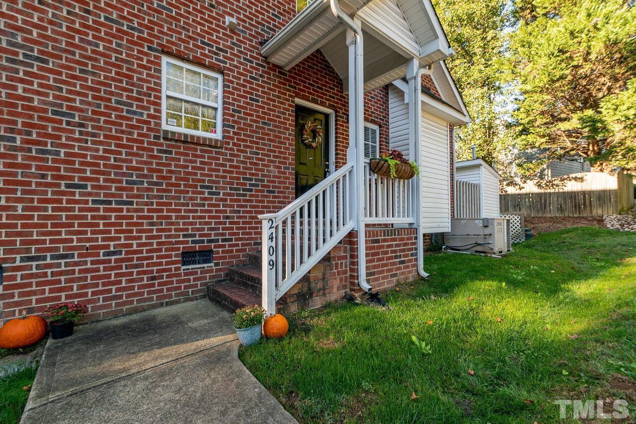 2409 Trout Stream Drive Raleigh, NC 27604 - Photo 3 of 27 a view of a house with a yard and pathway