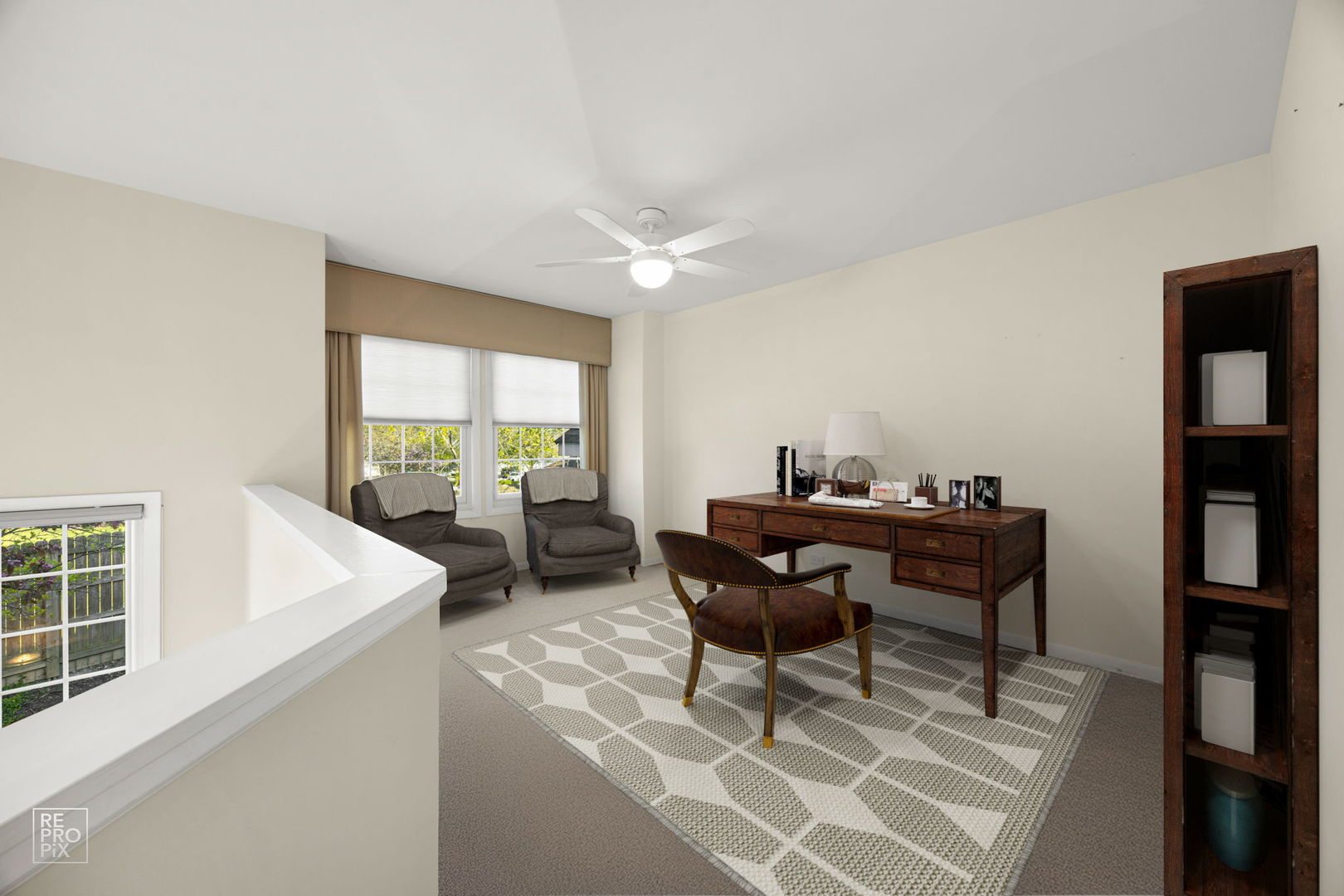 715 Brookvale Drive, Unit C Wheeling, IL 60090 - Photo 8 of 10 a living room with furniture a bookshelf and a window