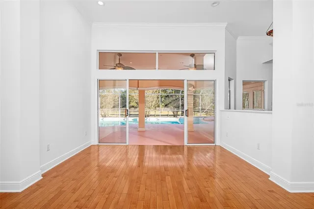a view of a room with wooden floor and closet