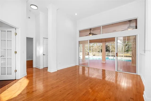 a large kitchen with stainless steel appliances a large counter top a stove a chimney a sink and a large window