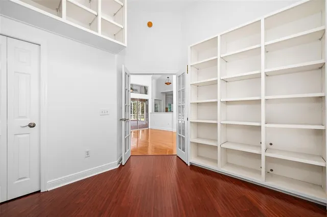 a kitchen with stainless steel appliances a sink a stove top oven a counter space and cabinets