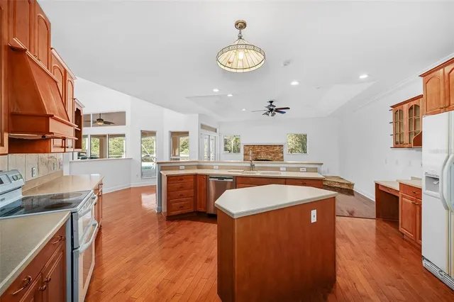 a bathroom with a sink a light fixture and a mirror