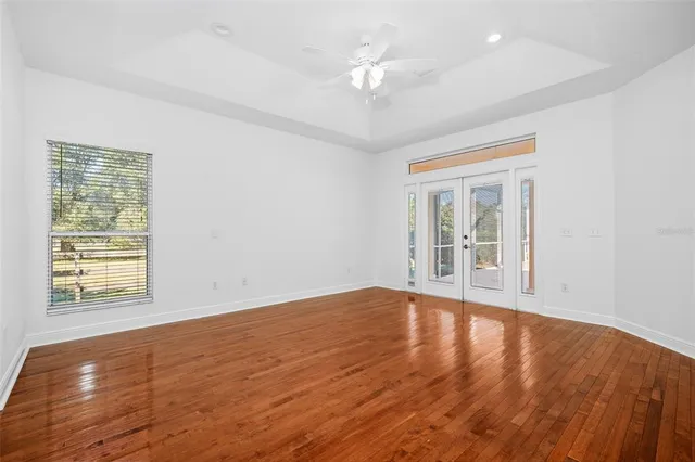 a view of balcony with wooden floor and fence