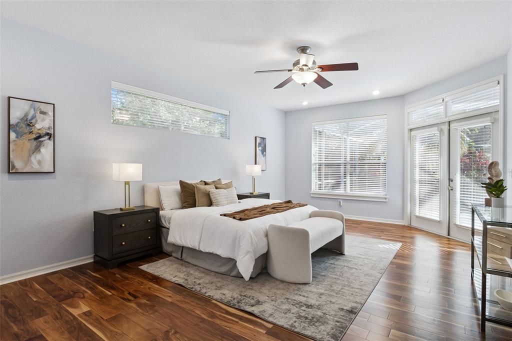 2125 Kane Park Way Windermere, FL 34786 - Photo 22 of 63 a bedroom with a large bed and a chandelier