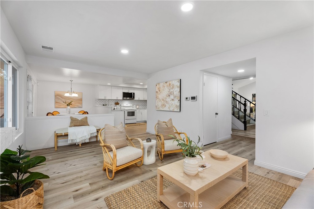16 East Yale Loop, Unit 28 Irvine, CA 92604 - Photo 13 of 44 a living room with furniture and a potted plant