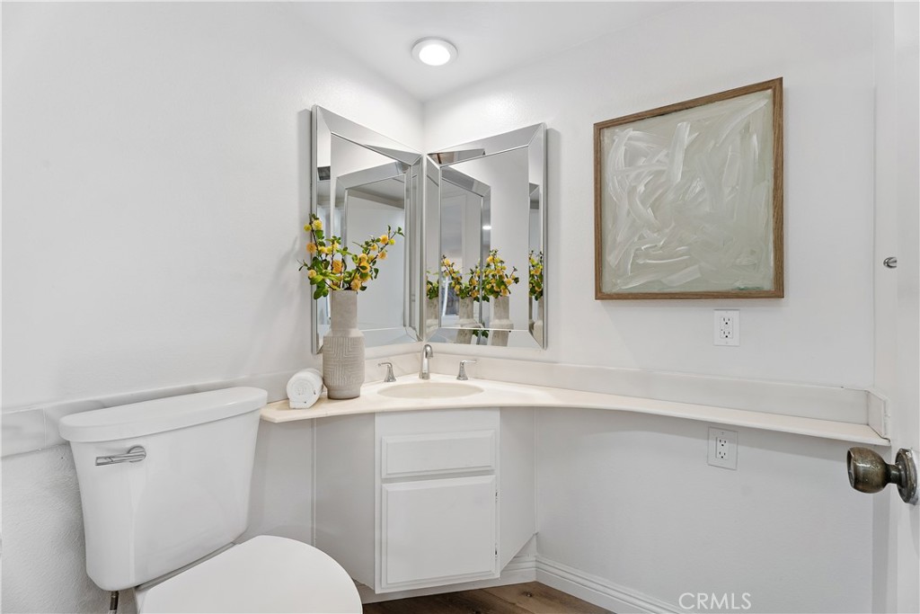 16 East Yale Loop, Unit 28 Irvine, CA 92604 - Photo 16 of 44 a bathroom with a toilet sink and mirror