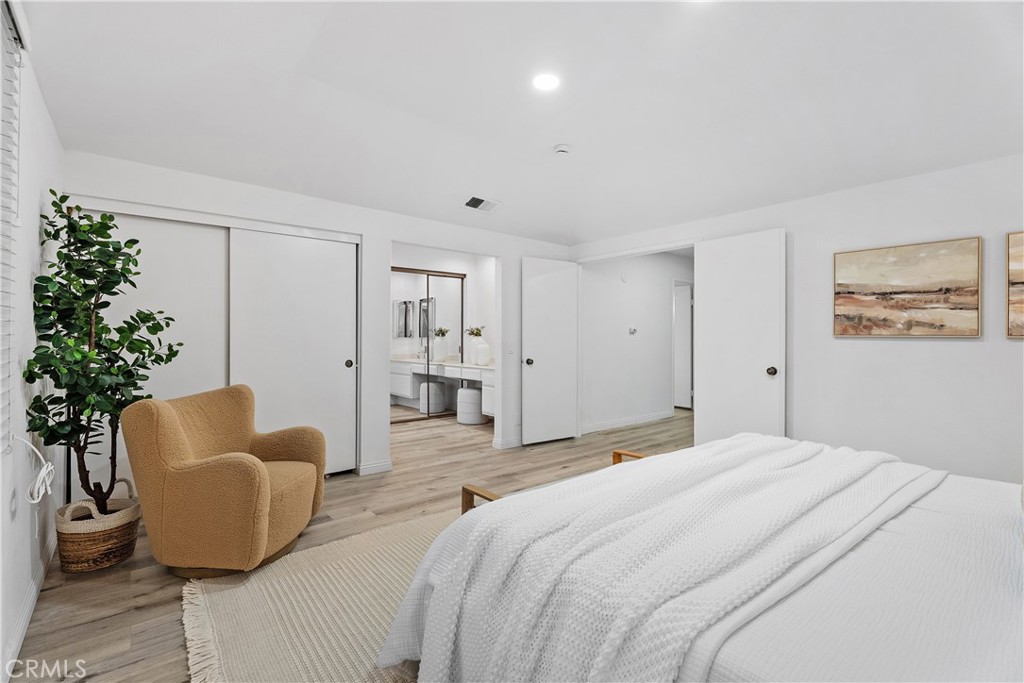 16 East Yale Loop, Unit 28 Irvine, CA 92604 - Photo 20 of 44 a bedroom with bed and a couch