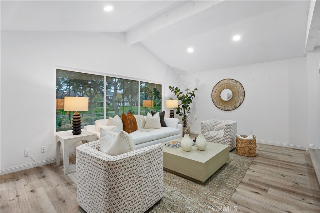 16 East Yale Loop, Unit 28 Irvine, CA 92604 - Photo 2 of 44 a living room with furniture and a large window