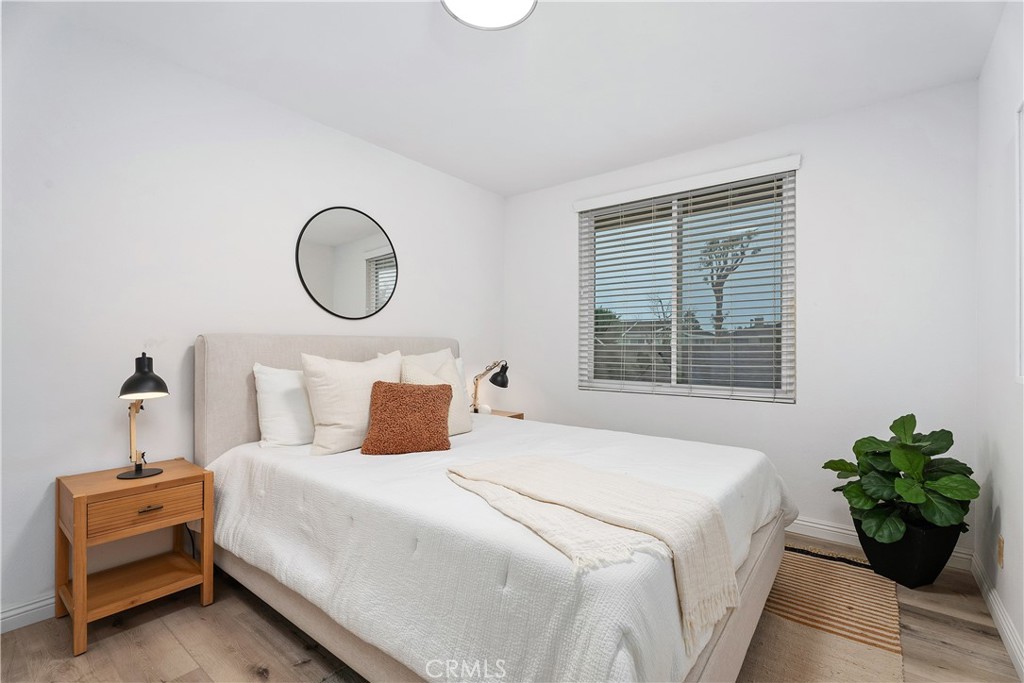 16 East Yale Loop, Unit 28 Irvine, CA 92604 - Photo 24 of 44 a bedroom with a bed and a window