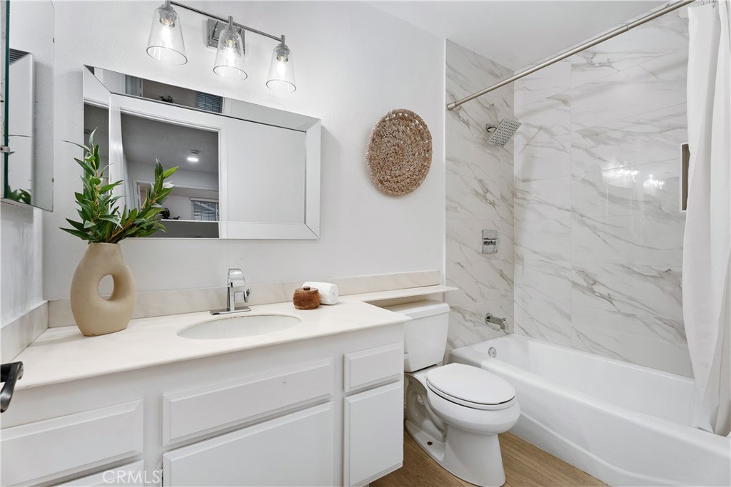 16 East Yale Loop, Unit 28 Irvine, CA 92604 - Photo 26 of 44 a bathroom with a sink a toilet and shower