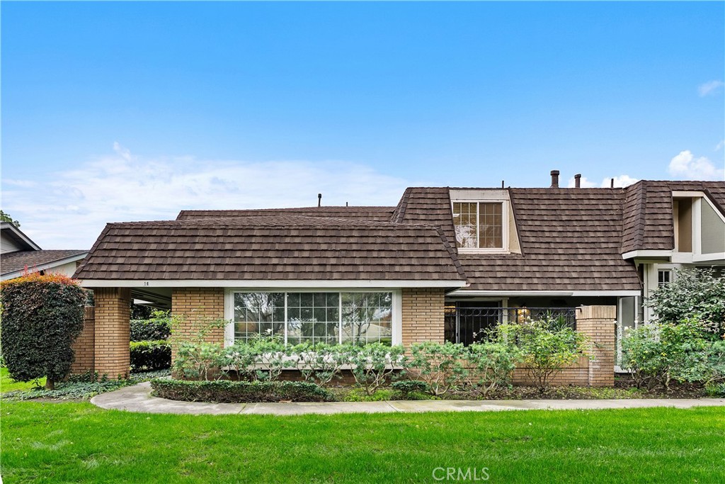 16 East Yale Loop, Unit 28 Irvine, CA 92604 - Photo 35 of 44 front view of a house with a yard