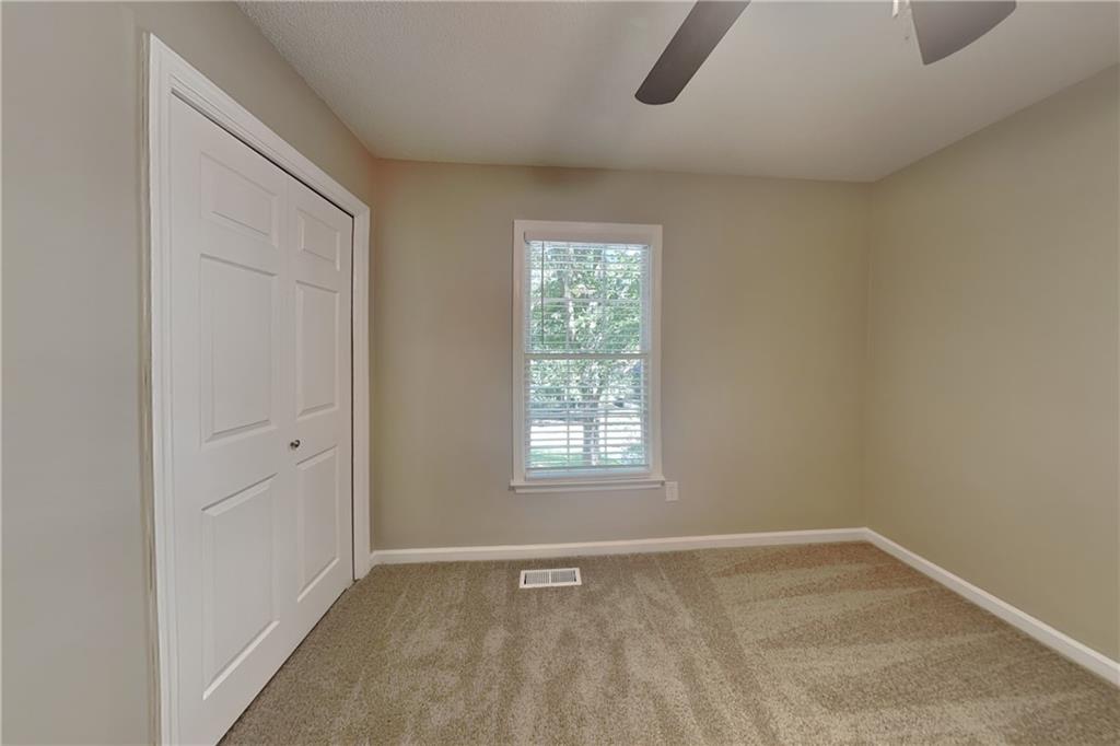 5394 Muirwood Place Powder Springs, GA 30127 - Photo 12 of 18 an empty room with windows