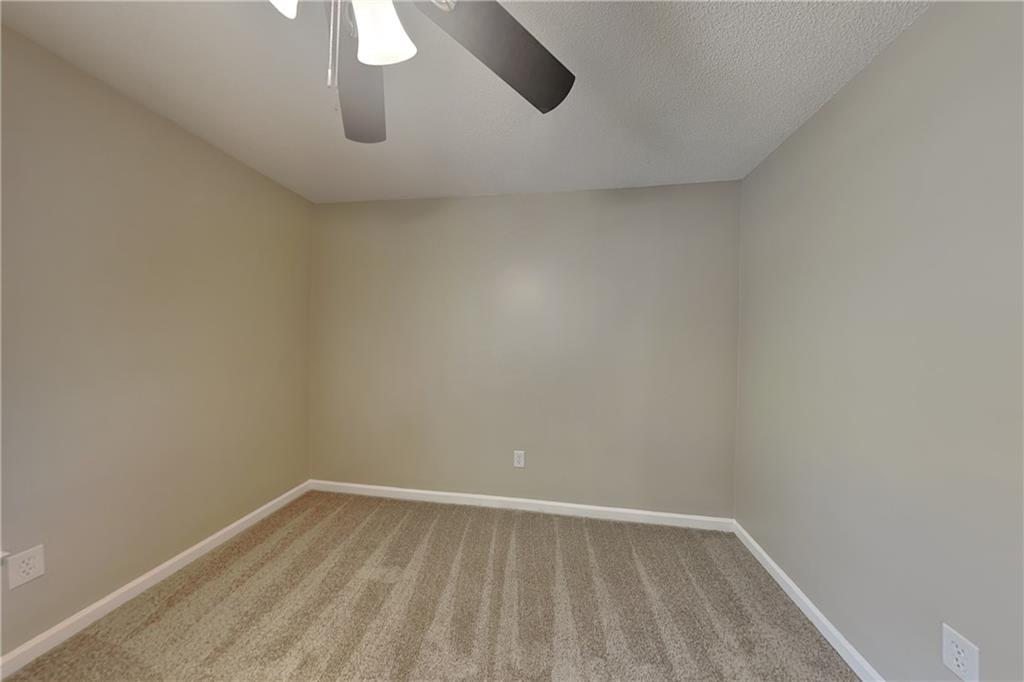 5394 Muirwood Place Powder Springs, GA 30127 - Photo 13 of 18 a view of an empty room