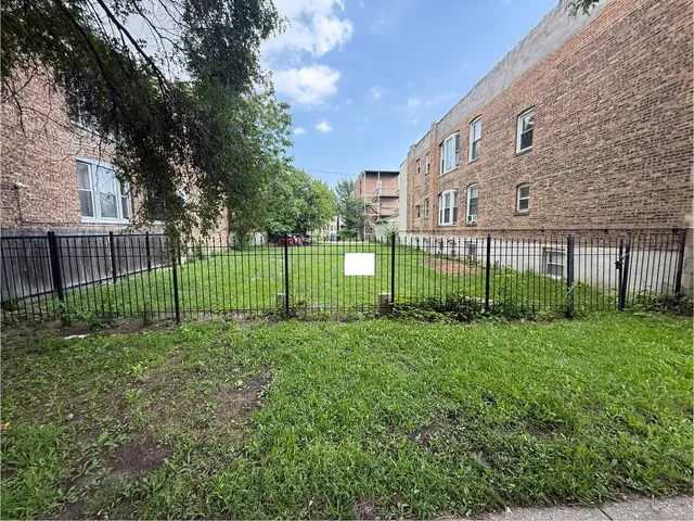 a view of a garden in front of a house