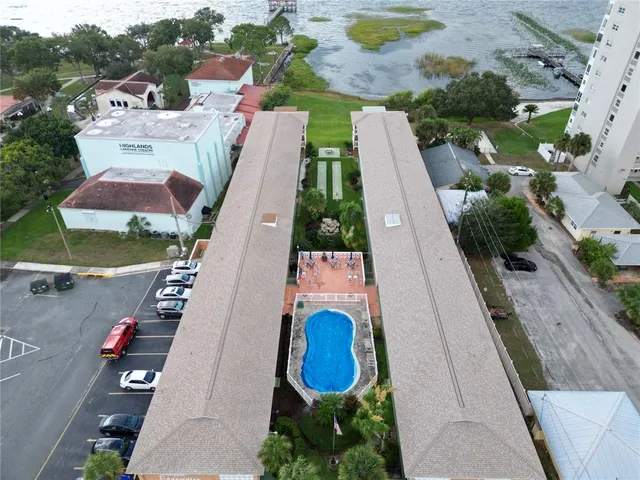 an aerial view of a house with swimming pool