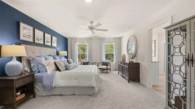 a view of a kitchen with furniture and wooden floor