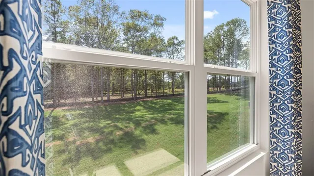 a bedroom with a large bed and a dresser