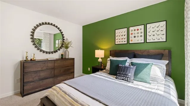 a bed room with a bed and a dresser