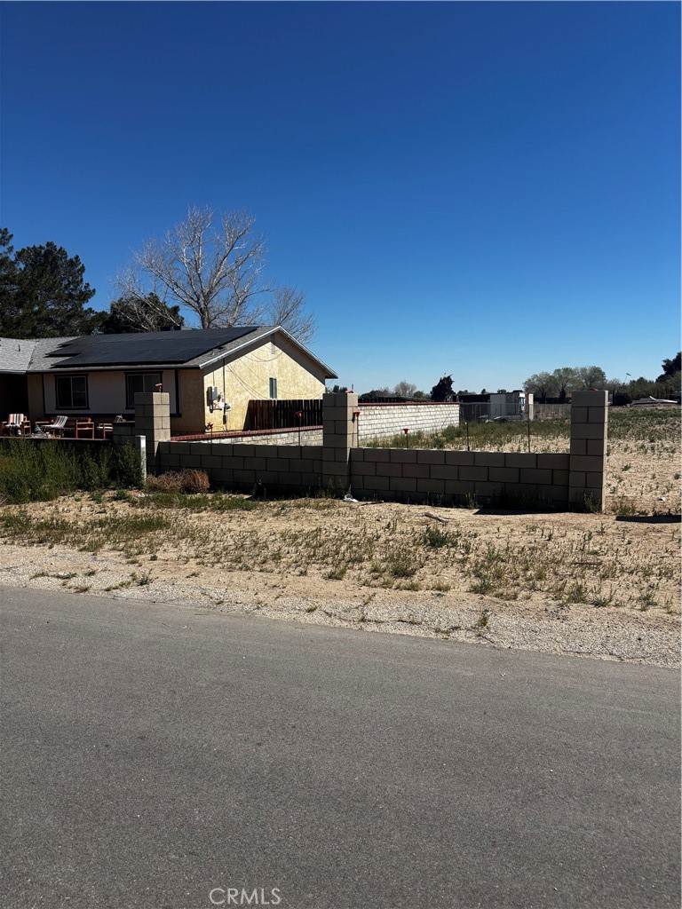 0 152nd Street East Lancaster, CA 93535 - Photo 20 of 21 a front view of a house with a yard