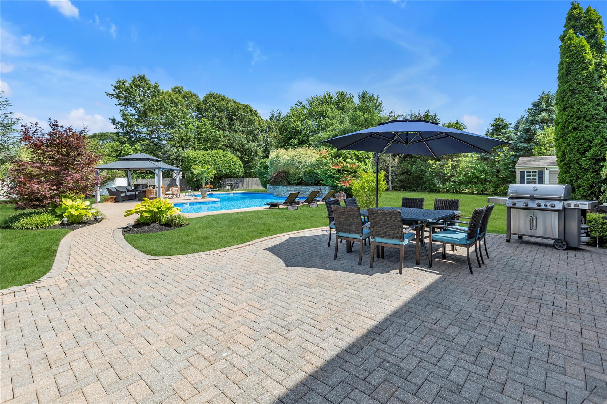 265 Hidden Acres Path Wading River, NY 11792 - Photo 29 of 46 View of patio / terrace with a gazebo, outdoor dining space, an outdoor pool, a shed, and grilling area