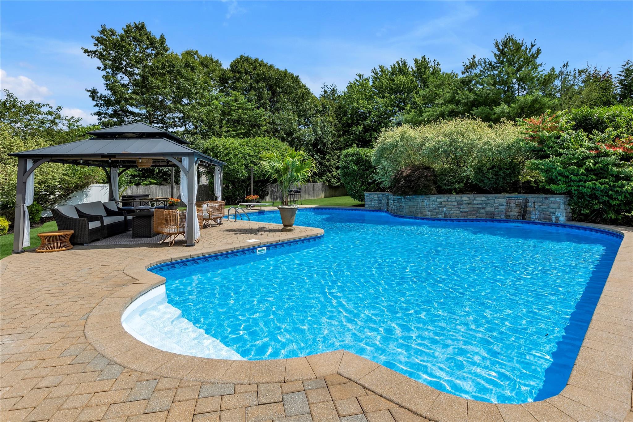 265 Hidden Acres Path Wading River, NY 11792 - Photo 31 of 46 Outdoor pool with an outdoor living space, a gazebo, a patio area, a fenced backyard, and view of wooded area