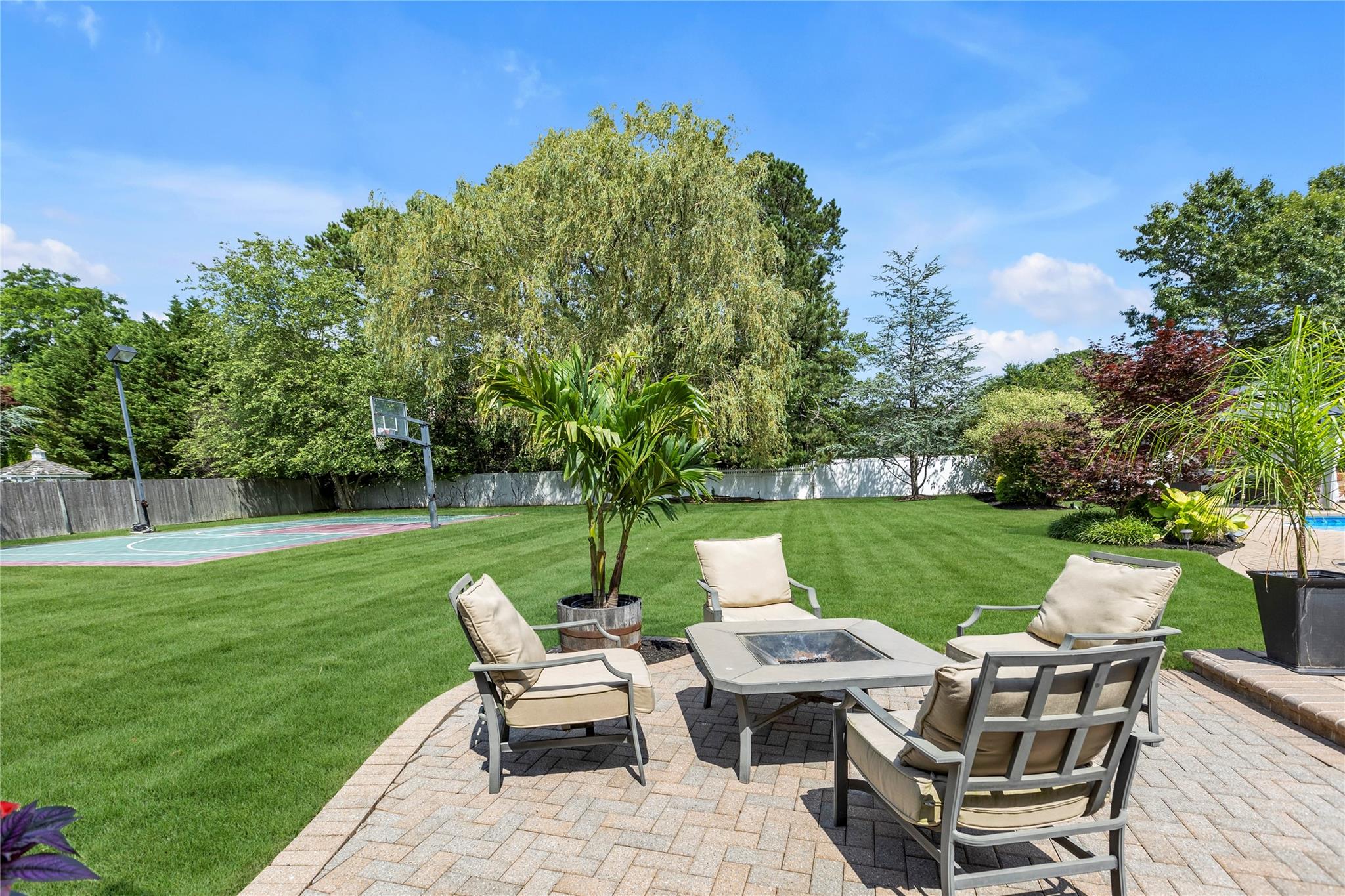 265 Hidden Acres Path Wading River, NY 11792 - Photo 35 of 46 Fenced backyard featuring a fire pit
