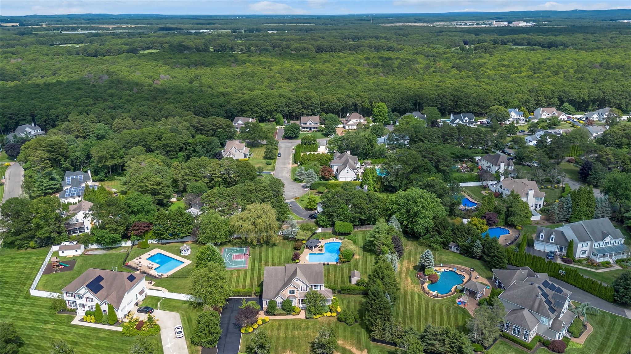 265 Hidden Acres Path Wading River, NY 11792 - Photo 43 of 46 Aerial overview of property's location with a heavily wooded area and a pool area