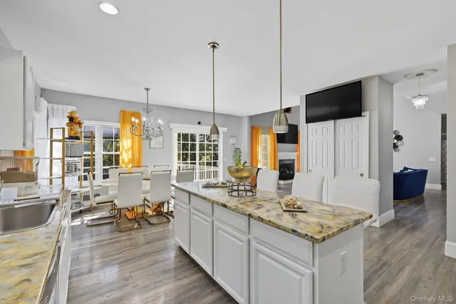 a open kitchen with sink cabinets and wooden floor