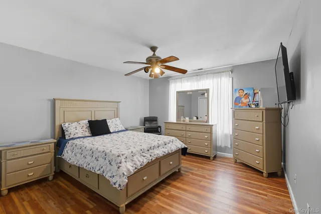 a bedroom with a bed and a dresser