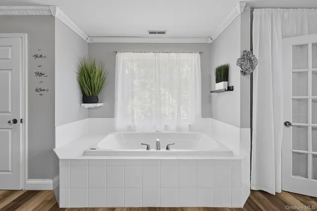 a white bath tub sitting in a bathroom