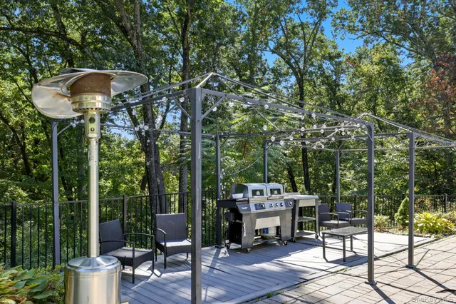 a view of a chairs and table in a patio