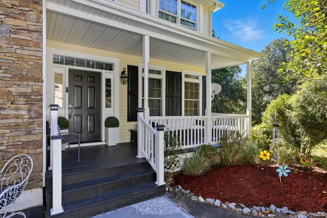 a view of porch with a bench