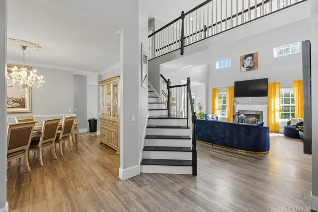 a view of dining room with furniture wooden floor and window
