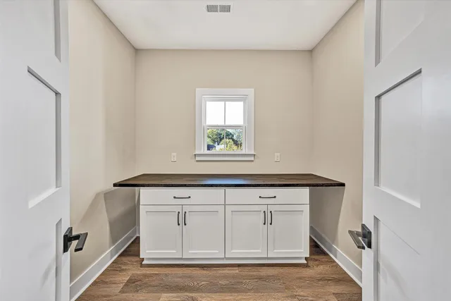 a view of cabinets with wooden floor