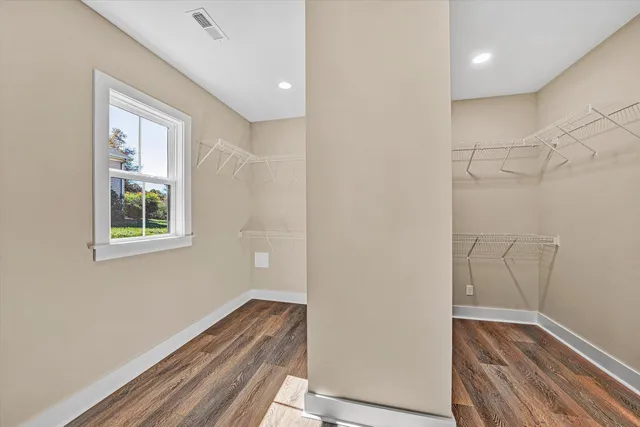 a room with a window and wooden floor