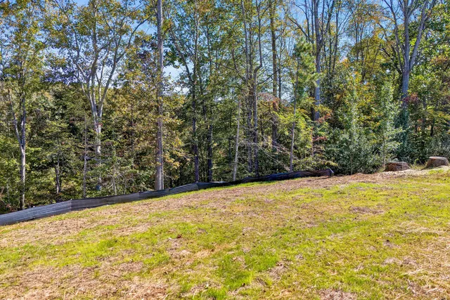 a view of empty room with wooden fence