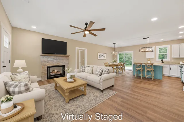 a living room with furniture fireplace and a flat screen tv