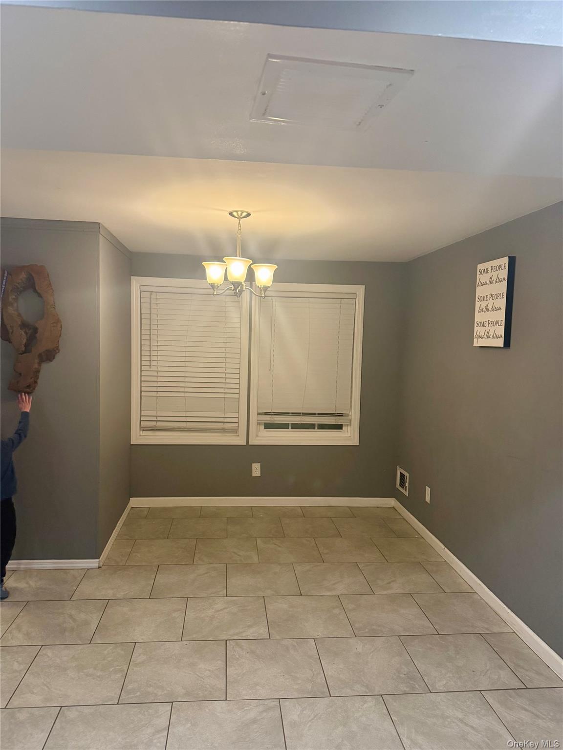 47 College Road Selden, NY 11784 - Photo 12 of 15 Unfurnished room with baseboards and suspended lighting