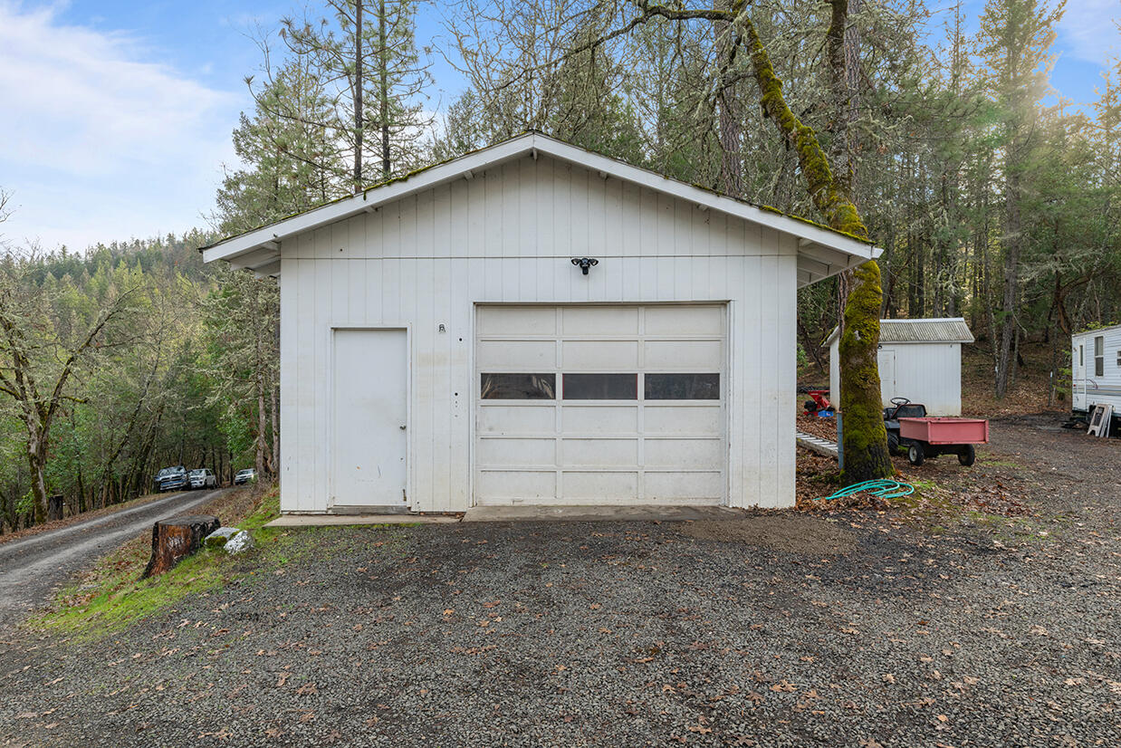 2900 Indian Creek Road Shady Cove, OR 97539 - Photo 20 of 35 a view of a white house with a yard